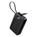 Anker A1647 20000mAh power bank in black with built-in USB-C cable, digital battery display, dual charging ports, and compact travel-friendly design.