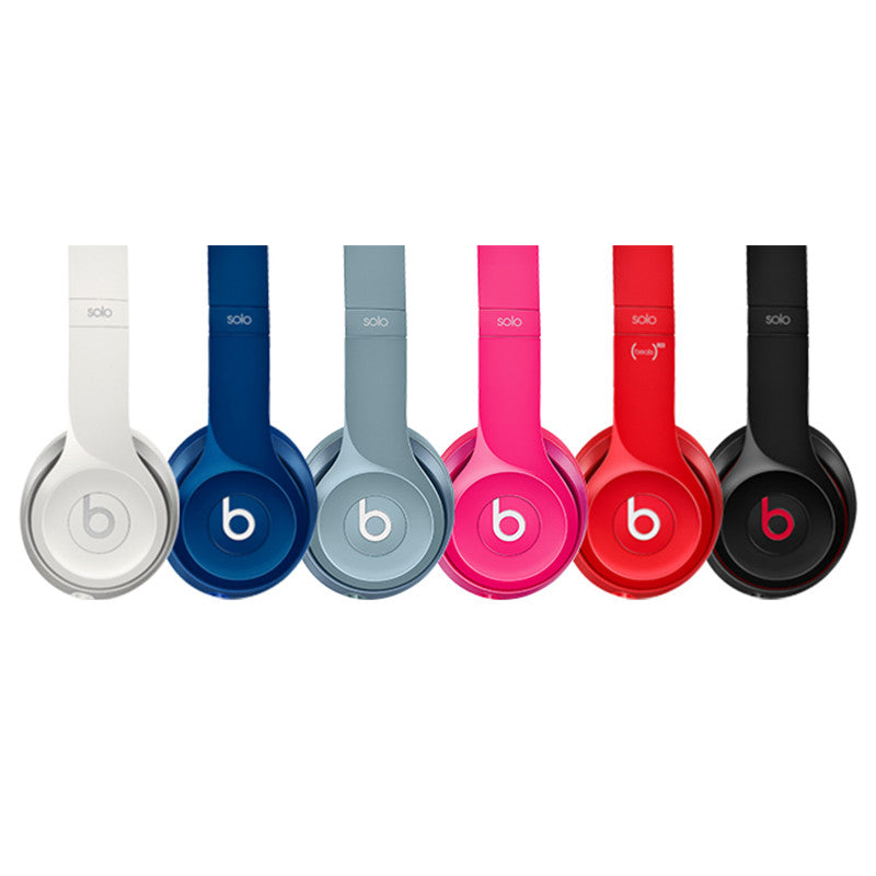 Set of six Beats headphones in different colors on a white background