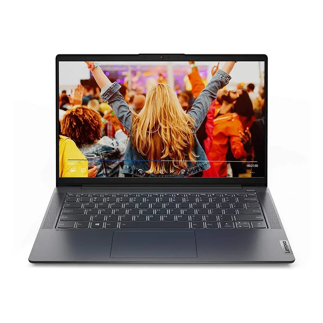 Laptop displaying a person with raised arms at a concert on a white background