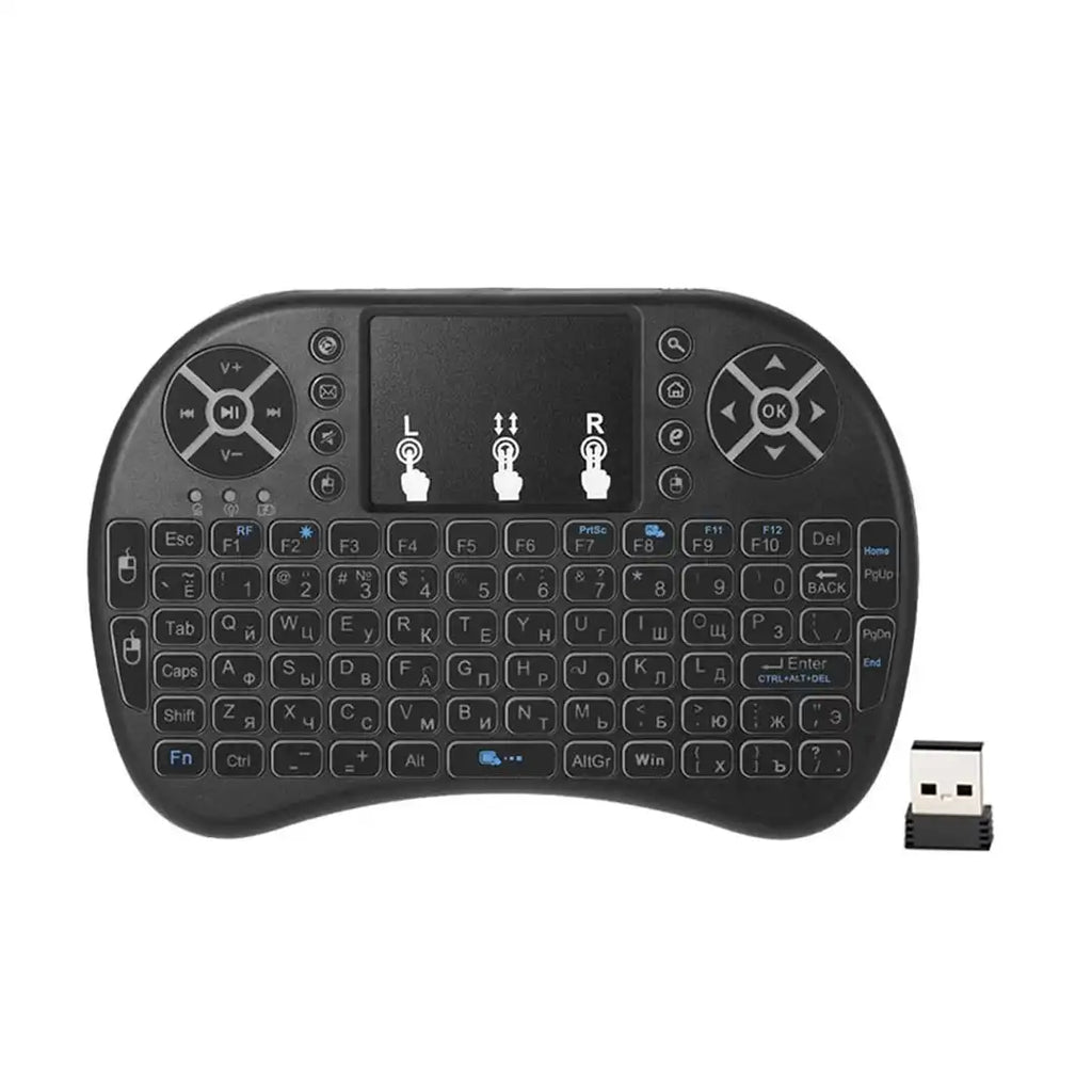 Black wireless keyboard with touchpad and USB receiver on a white background